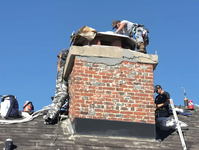 Strongsville Chimney Sweep installing a custom chimney crown in Strongsville, OH