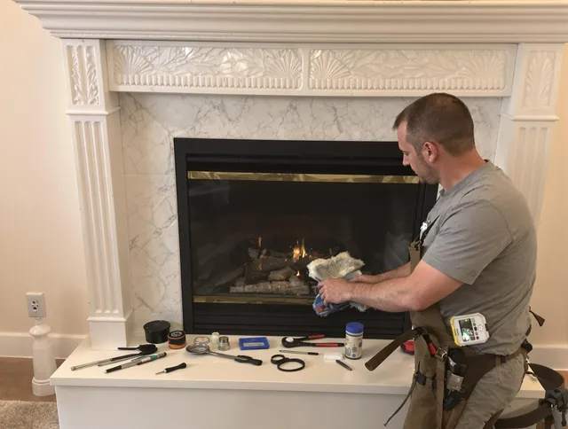 Strongsville Chimney Sweep performing fireplace maintenance in Strongsville, OH